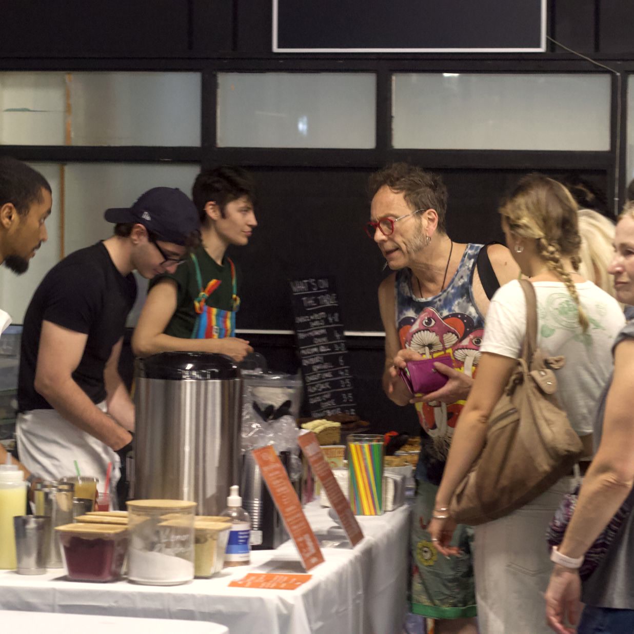 Guests crowding round the Sanabode table at Bristol Vegan Fayre