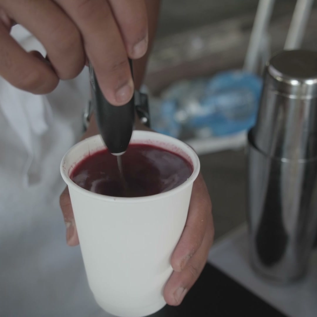 Pouring a drink at the stall under the M32