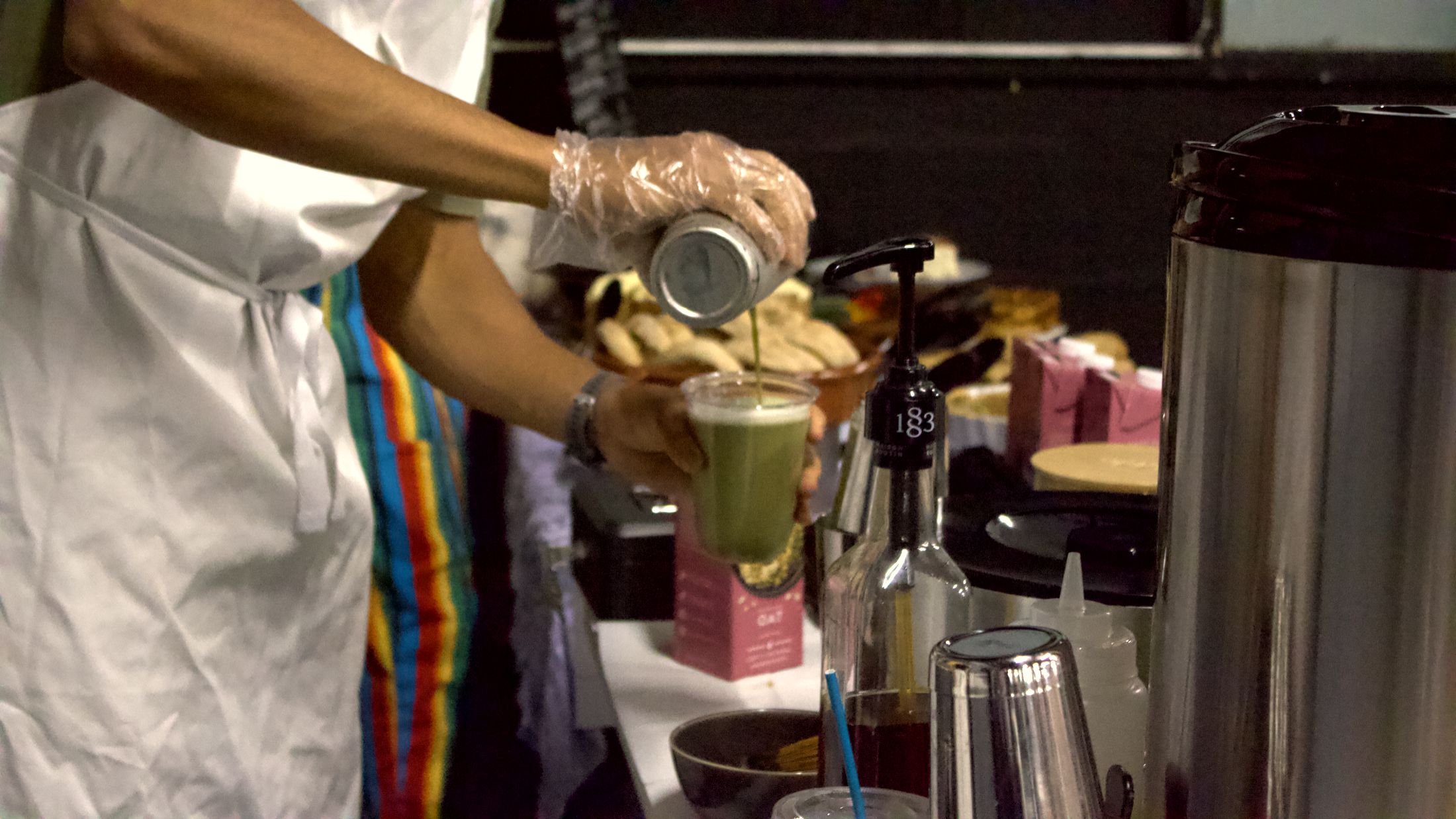 A green matcha blend being poured at the Sanabode table
